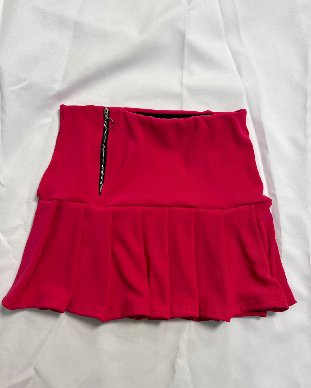 Falda tableada fucsia